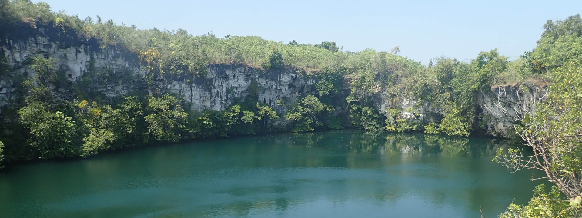 Sulawesi Sumatra Java Kalimantan Cave diving exploration technical diver sidemount freshwater cave in Pulau muna. Cave Entry in Wakatobi. Cave diving in indonesia. Pulau Buton or Wakatobi, Sulawesi.